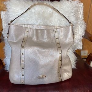 A beautiful authentic coach bag Gold metallic color with simple hardware